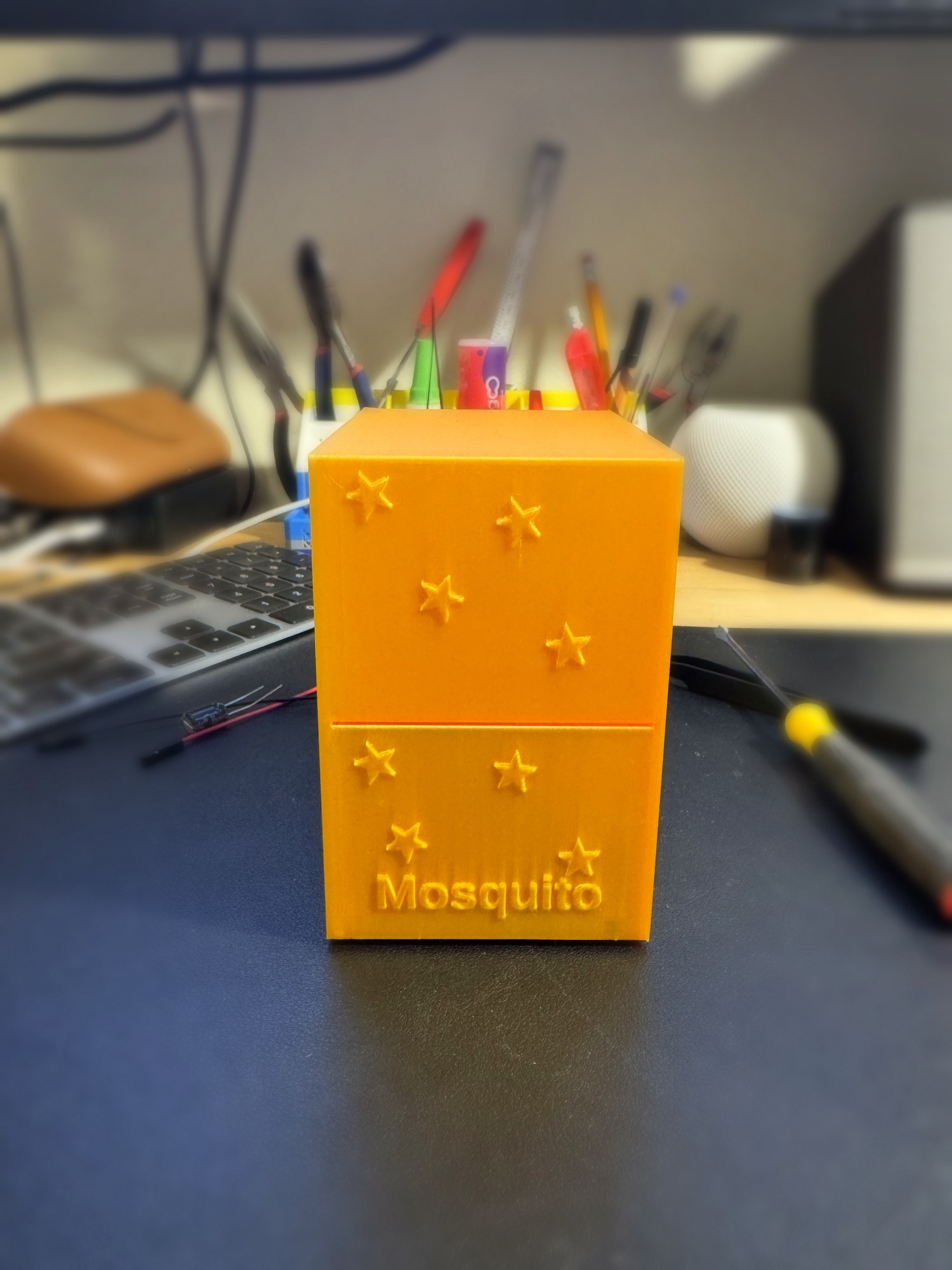 The PointsPop Mosquito card dispenser, a 3D-printed device with embossed stars and 'Mosquito' branding